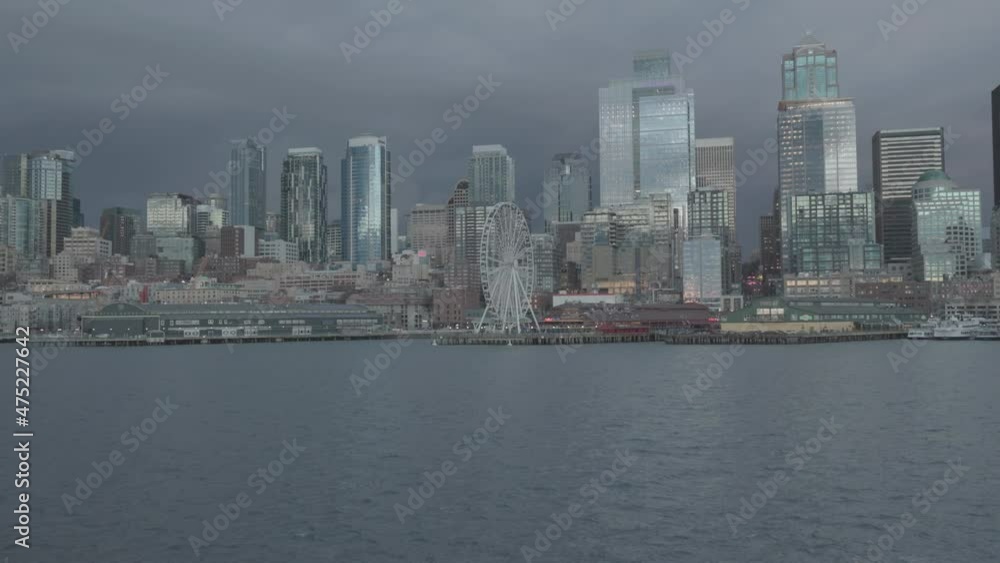 Beautiful Shot Of The City Of Seattle Washington Shot From The Water featuring the Great Wheel of Seattle and A beautiful view of the city. Beautiful Shot Of The City Of Seattle Washington Shot From The Water featuring the Great Wheel of Seattle and A beautiful view of the city.