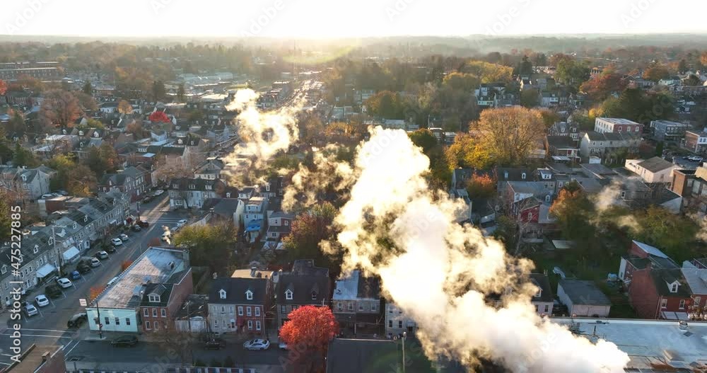 Air pollution and smog. Steam and smoke exhaust from factory building in urban town. Slow motion clip. Air pollution and smog. Steam and smoke exhaust from factory building in urban town. Slow motion clip.