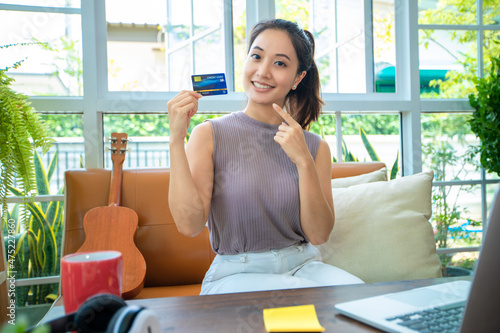 Asian woman is holding credit card and using smartphone shopping online at home. Online shopping e-commerce internet banking spending money working from home concept Free Download Asian woman is holding credit card and using smartphone shopping online at home. Online shopping e-commerce internet banking spending money working from home concept - GFXLoad