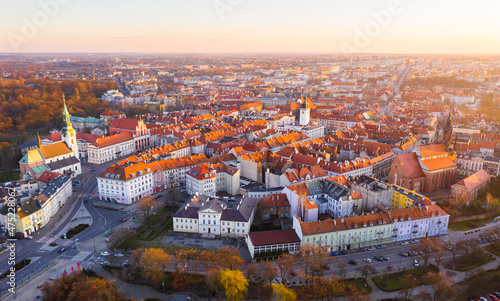 Obraz na płótnie View from drone of Kalisz cityscape at sundown overlooking steeples of Cathedral of St