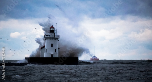 Cleveland Harbor West Pierhead Lighthouse in heavy surf and high winds photo