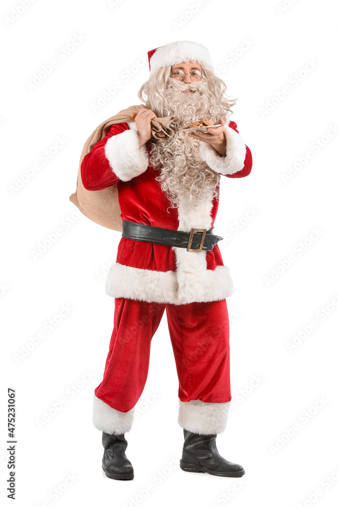 Santa Claus holding plate with cookies and bag on white background Santa Claus holding plate with cookies and bag on white background