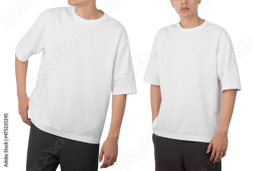 Young man in blank oversize t-shirt mockup front and back used as design template, isolated on white background with clipping path.