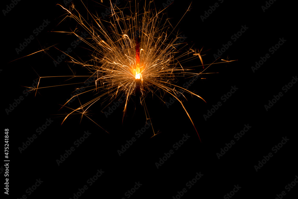 Close up of Shinny sparkling bengal lights on a black background. Christmas new year birthday celebration concept. Fireworks pyrotechnics