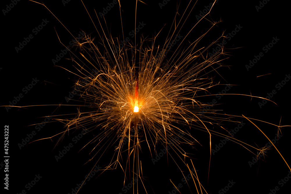 Close up of beautiful bengal lights sparklers on a black background. Christmas new year birthday celebration magic concept. Fireworks pyrotechnics burn