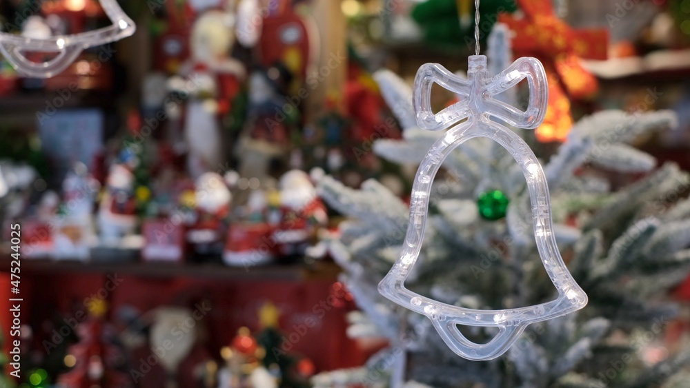 Close up of Chrismas lights in bell shape, symbol of holidays, shopping for xmas tree and home decoration, new year eve tradition Close up of Chrismas lights in bell shape, symbol of holidays, shopping for xmas tree and home decoration, new year eve tradition