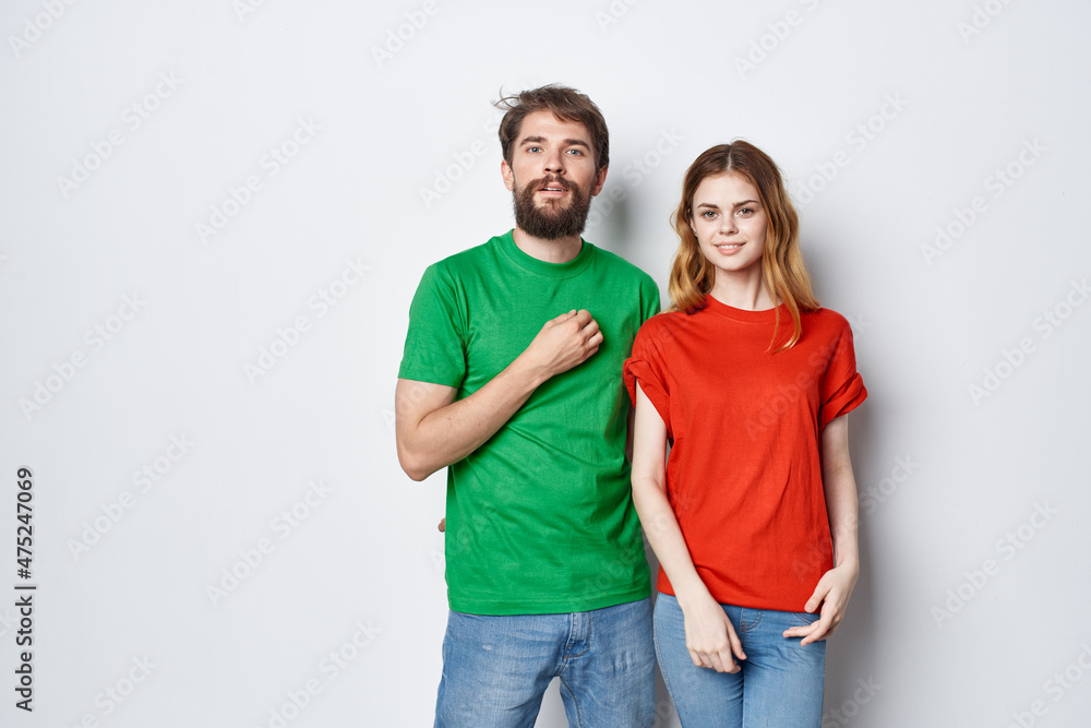 man and woman hug friendship colorful t-shirts family light background man and woman hug friendship colorful t-shirts family light background