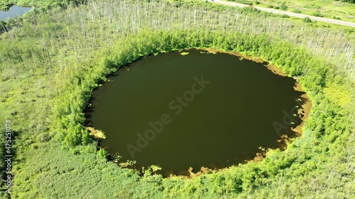 Aerial view of Bottomless  Lake in forest of Solnechnogorsk District, Moscow region. Russia. Aerial view. The lake is perfectly round and its depth is not determined. photo