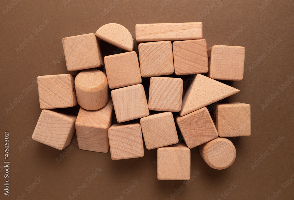 Wooden Geometric Shapes Cube on Paper Wooden Geometric Shapes Cube on Paper