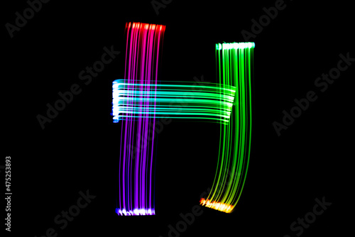 Letter H. Isolated figure on a black background. Freezelight.