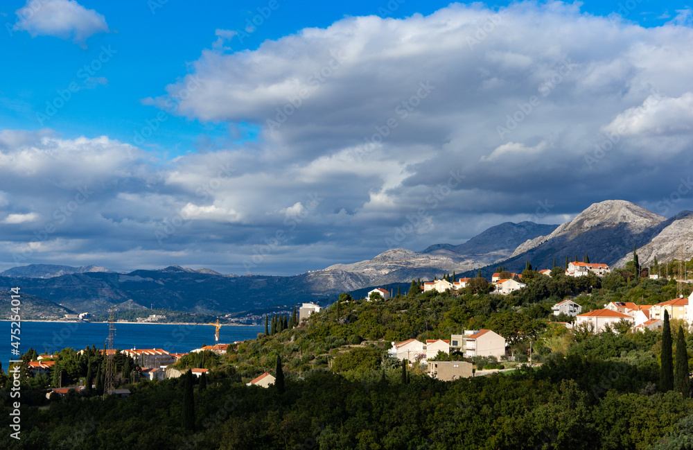 Mountains on the Adriatic coast. Settlements on the shore.