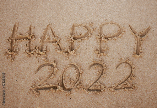 Start and go 2022 on the sand at the beach to show life ahead next year. background