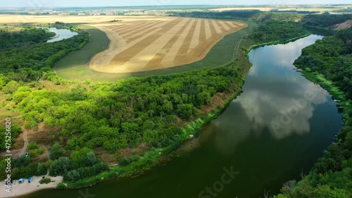 The tract Krivobor’ye the steep wooded sandy slopes of the Don river. A steep sandy cliff overgrown with forest on the Don River. The right bank is sandy, high and steep, and the left bank is flat and