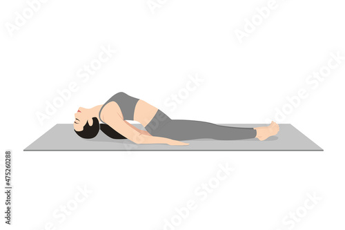 Fish Pose, Beautiful girl practice Matsyasana. Young attractive woman practicing yoga exercise. working out, black wearing sportswear, grey pants and top, indoor full length, calmness and relax.