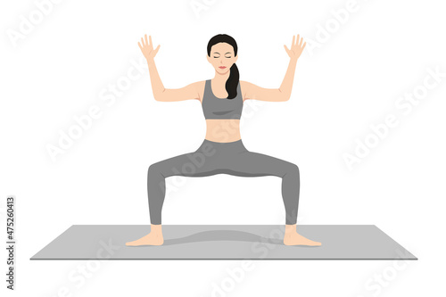 Goddess Pose, Fierce Angle Pose, Victory Squat Pose, Beautiful girl practice Utkata Konasana. Young attractive woman practicing yoga exercise. working out, black wearing sportswear, grey pants and top