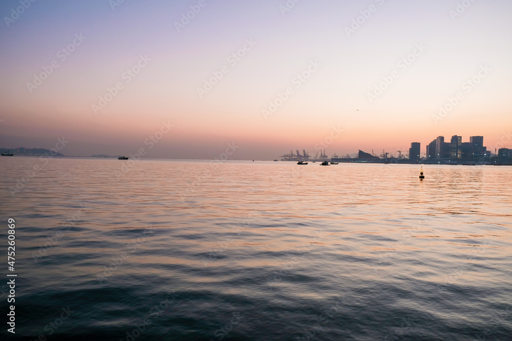Fototapeta premium Tranquil sea with sunset view