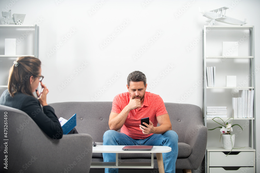Social worker psychologist talking to man. Depression counseling. Middle aged man crisis. Social worker psychologist talking to man. Depression counseling. Middle aged man crisis.