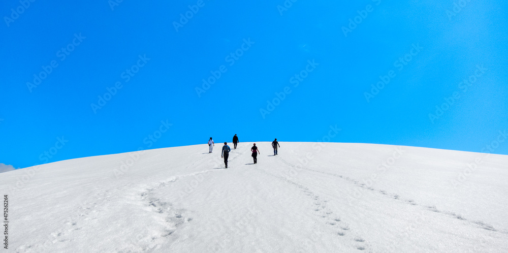 group of hikers, snowy hills