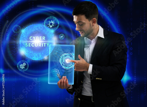 Business, Technology, Internet and network concept. Young businessman working on a virtual screen of the future and sees the inscription: Cyber security