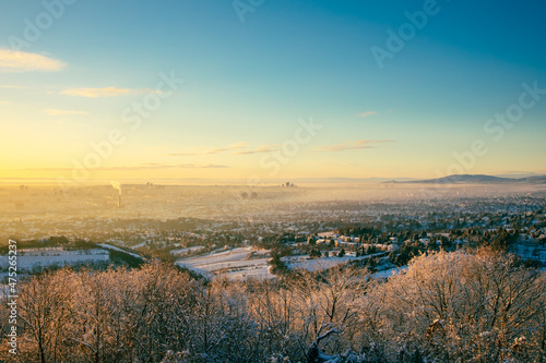 Vienna in Austria during winter. Sunrise morning cityview to the snow covered town in Europe.