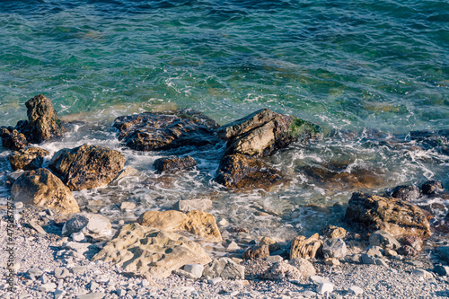 Rocky shore and blue sea water