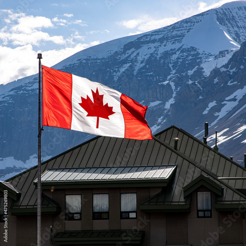 Canadian flag and Canadian rocky mountains