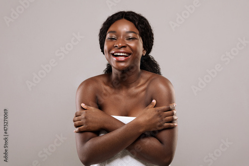 Flawless Beauty. Portrait Of Happy Laughing Beautiful Black Woman Wrapped In Towel