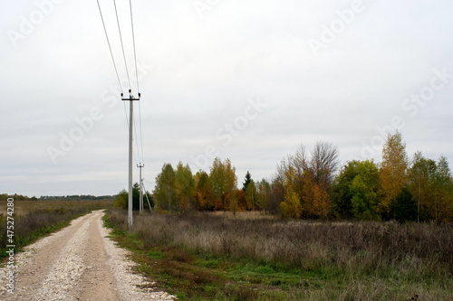 a rural road of gravel on a cloudy day © moskvich1977
