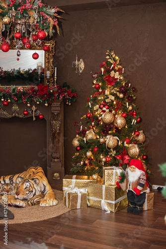 New Year's Christmas tree in the year of the tiger with Santa Claus gnome and toys