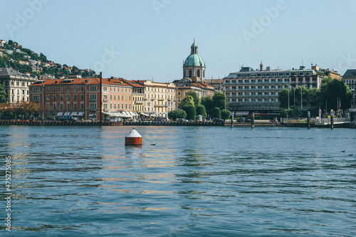 View of Como cathedral from lake and city buildings in northern Italy 