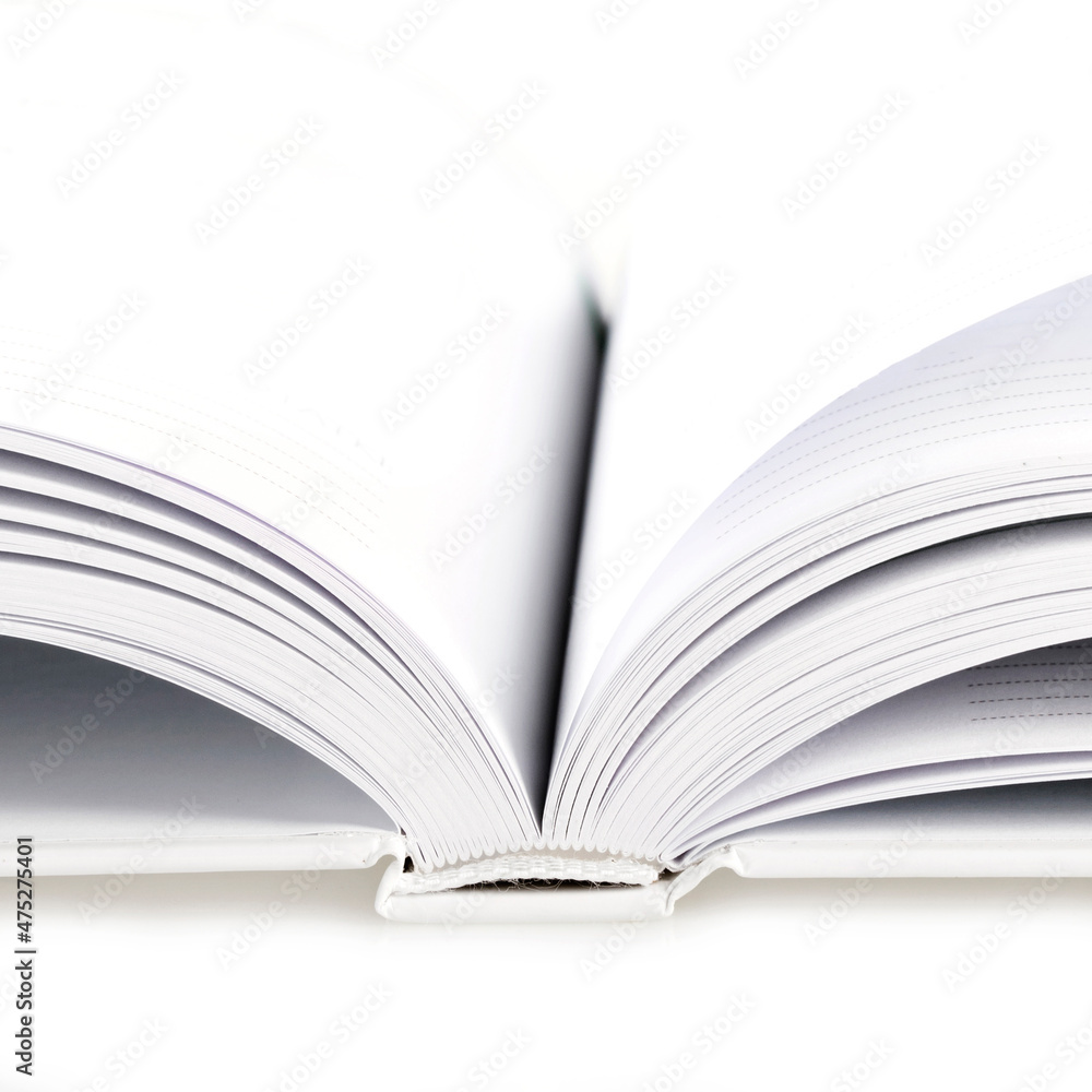 Fototapeta premium Open blank notebook, book with white sheets on white background. Studio shot.