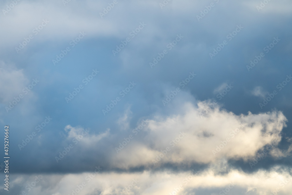 Gray-blue dark leaden clouds with snow. Snow charge, snowfall expected, cold atmospheric front. Winter, autumn clouds. Picture for weather forecast.