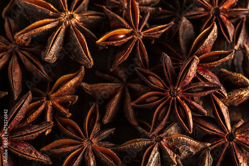 macrophotography of star anise on a wooden background. brown spice star anise is close