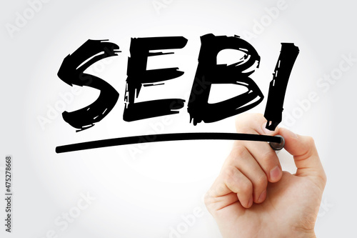 SEBI - Securities and Exchange Board of India acronym with marker, business concept background photo