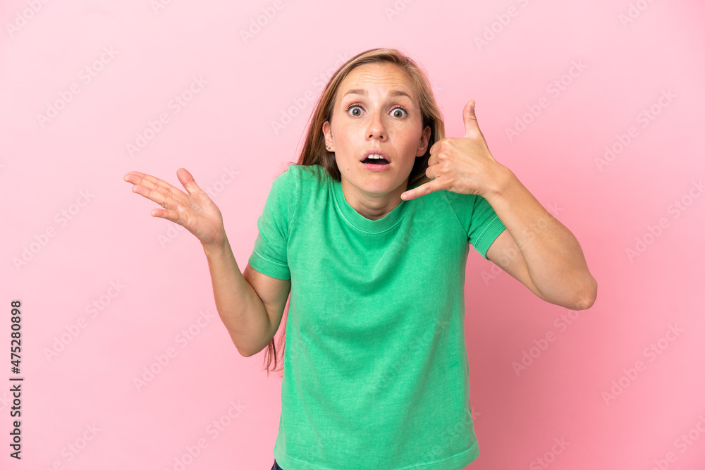 Young English woman isolated on pink background making phone gesture and doubting Young English woman isolated on pink background making phone gesture and doubting