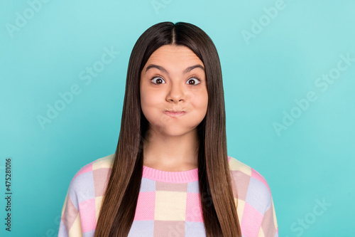 Photo of young girl have fun hold breath playful humorous stupid joke isolated over teal color background