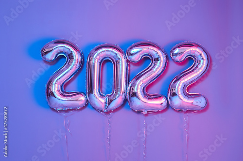 From above number balloons Christmas or New Year Festive purple background