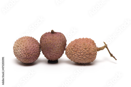 three ripe lychee different views white background