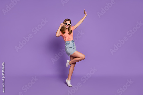 Fototapeta Naklejka Na Ścianę i Meble -  Full length body size view of attractive cheerful girl dancing resting having fun isolated on bright violet purple color background