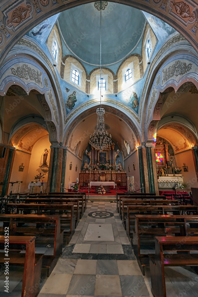 The interior of the Catholic cathedral of Saint John The Baptist in Fira of Santorini island in Greece