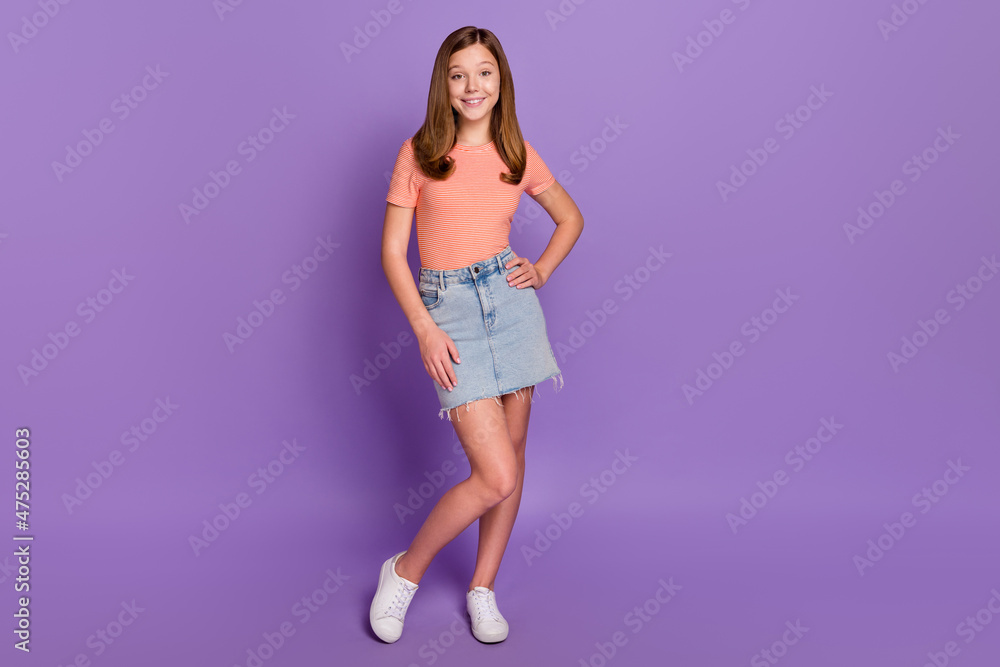 Full length body size view of attractive funky cheerful girl posing isolated over vibrant violet purple color background Full length body size view of attractive funky cheerful girl posing isolated over vibrant violet purple color background