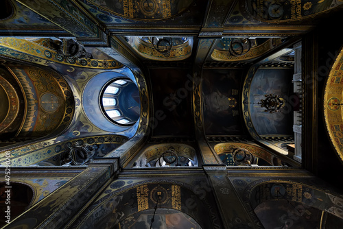 Dark distant ornate ceiling of Volodymyr's Cathedral in Kyiv Ukraine