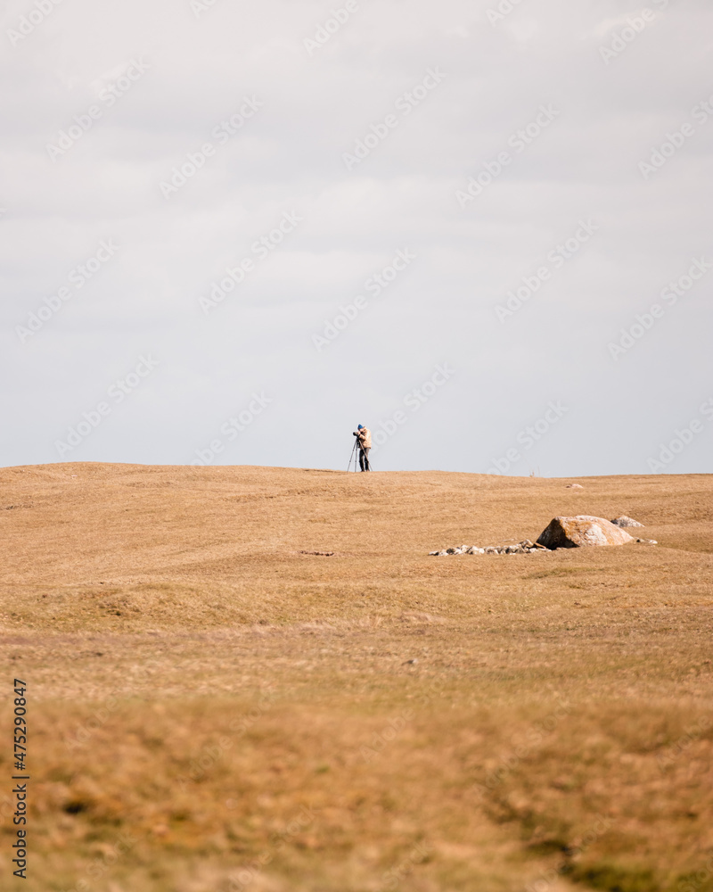 Fototapeta premium Photographer photographing landscapes in sweden