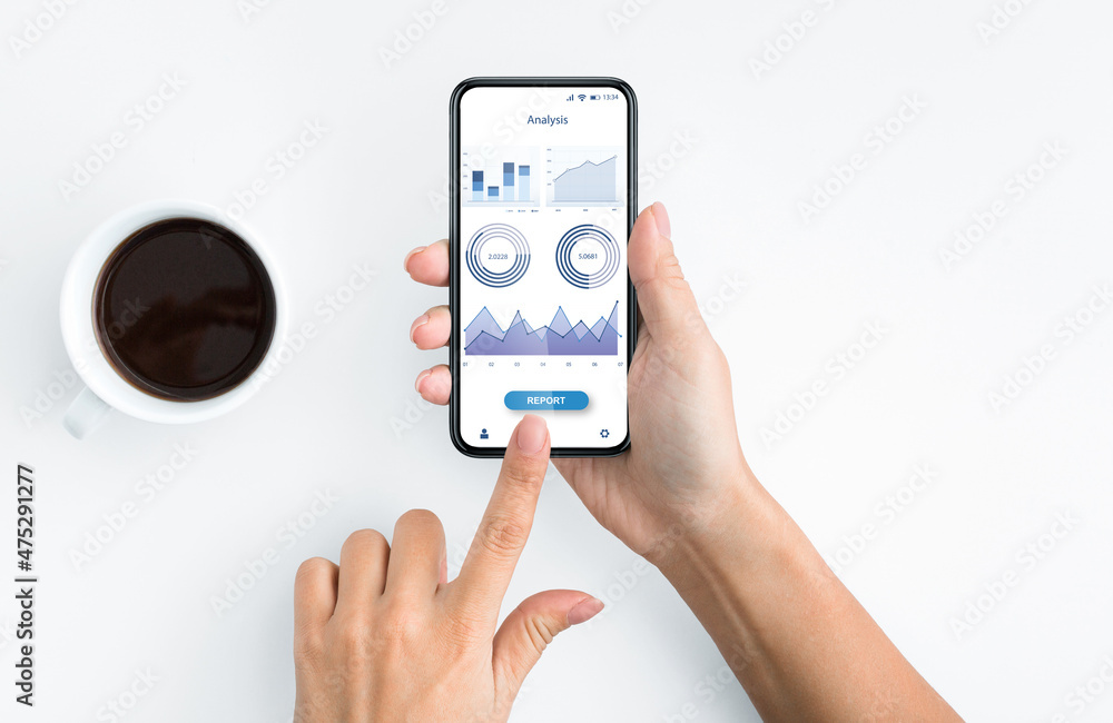 Woman using mobile app for financial operations analysis Woman using mobile app for financial operations analysis