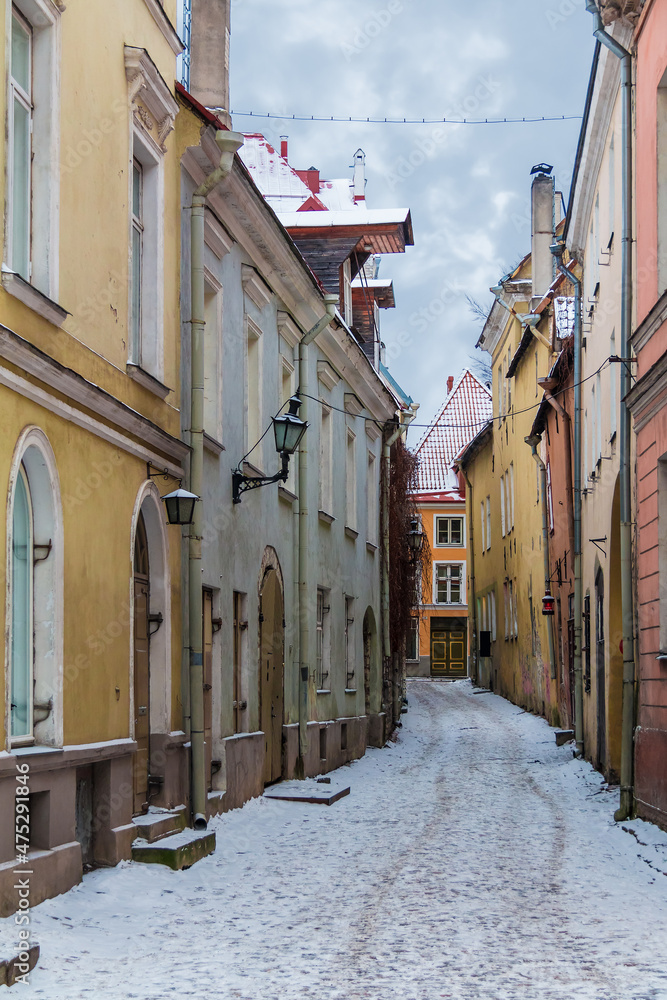 Perspective view of apartment buildings on the Vaimu Street in overcast winter day, Tallinn Old Town, Estonia
