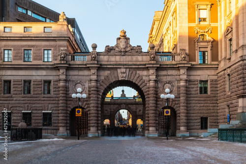 Perspective view of the Riksgatan Street and the arches of the Parliament House in sunny winter day, Stockholm, Sweden
 photo