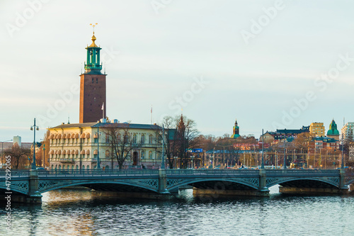 Panoramic view of Stockholm with the Vasabron Bridge, the Stromsborg Islet and the tower of the Stockholm City Hall in winter day, Sweden
 photo
