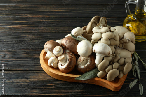 Concept of tasty food with mushrooms on wooden background