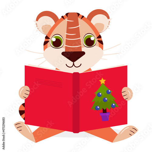 Cute tiger looks and reads a bright red New Year's book with a Christmas tree on the cover. Vector graphic.	