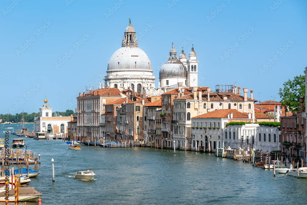 Grand Canal on sunny summer day with Santa Maria Salute and blue sky